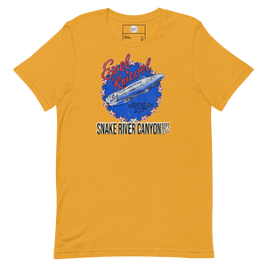 Evel Knievel® Snake River Canyon 1974 tee in mustard, front view: the Skycycle X-2 rocket on a starred blue badge above SNAKE RIVER CANYON SEPT. 8 1974