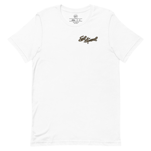 Front of the Evel Knievel® Snake River 1974 souvenir tee in white, with the Evel Knievel signature printed small on the left chest